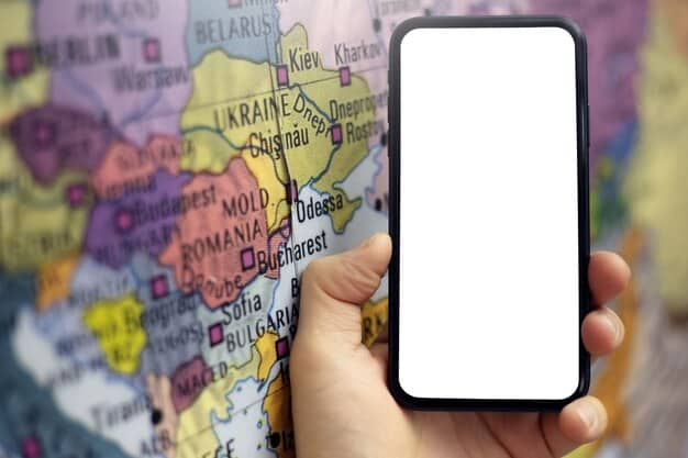 A close-up of a smartphone displaying a travel advisory website, showing a map with countries highlighted in different colors indicating risk levels. The focus is on the screen clarity and the color-coded system.