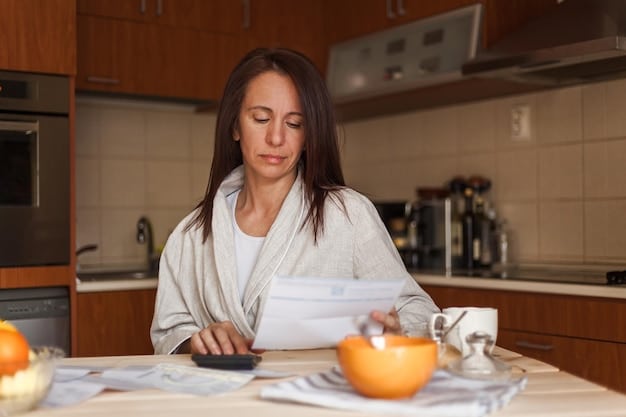 A medium shot of a stressed individual comparing bills and receipts at a kitchen table, with a laptop displaying budgeting software in the background. The lighting is soft, emphasizing the tension and financial strain.